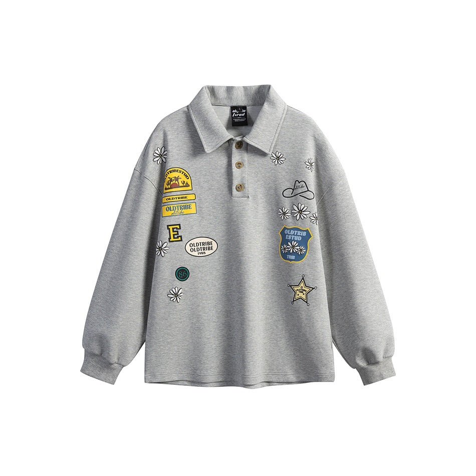 Heather gray long-sleeve polo sweatshirt with daisy and patch-style graphic prints and ribbed cuffs, front view