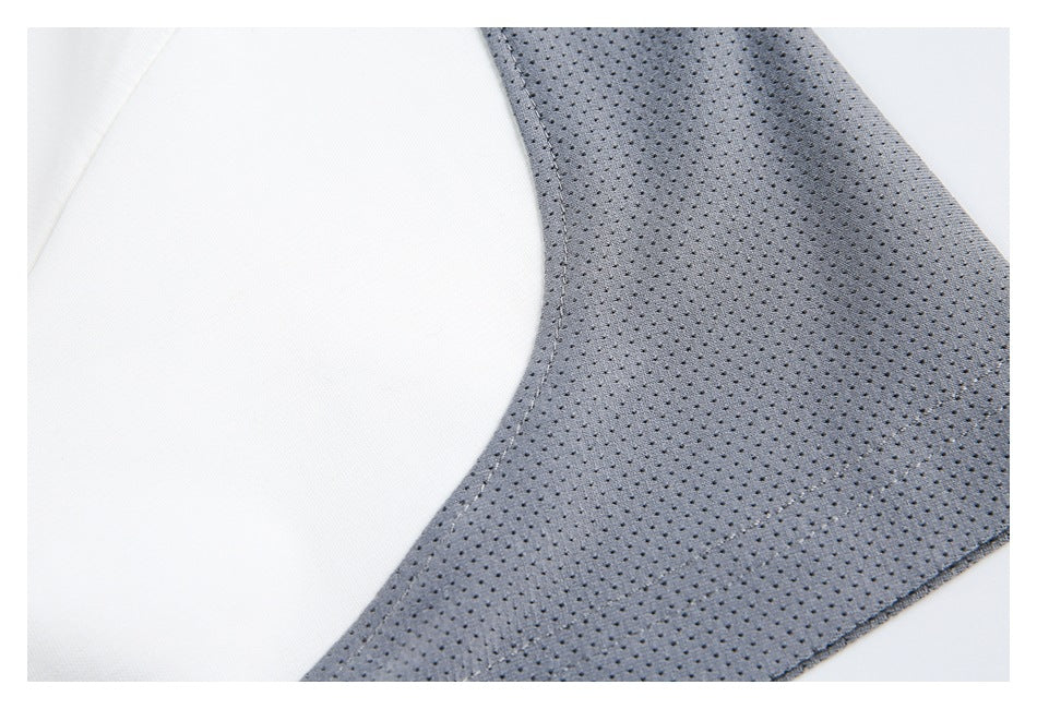 Close-up of gray perforated mesh panel beside a curved white garment panel.