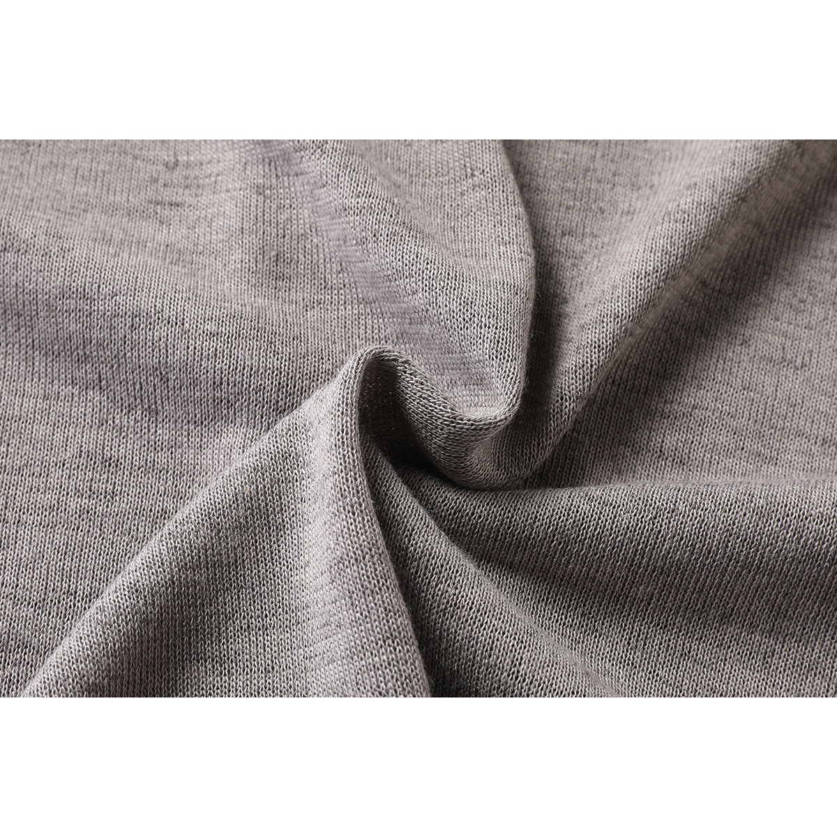 Close-up showing the knit texture of heather gray T-shirt fabric.