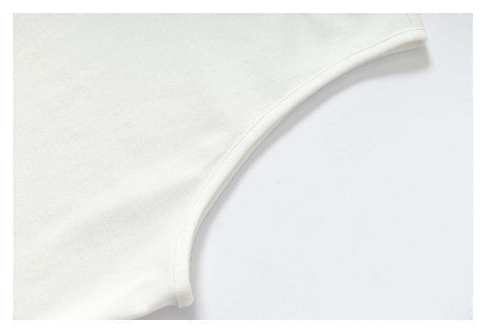 Close-up of a curved stitched edge on white fabric.