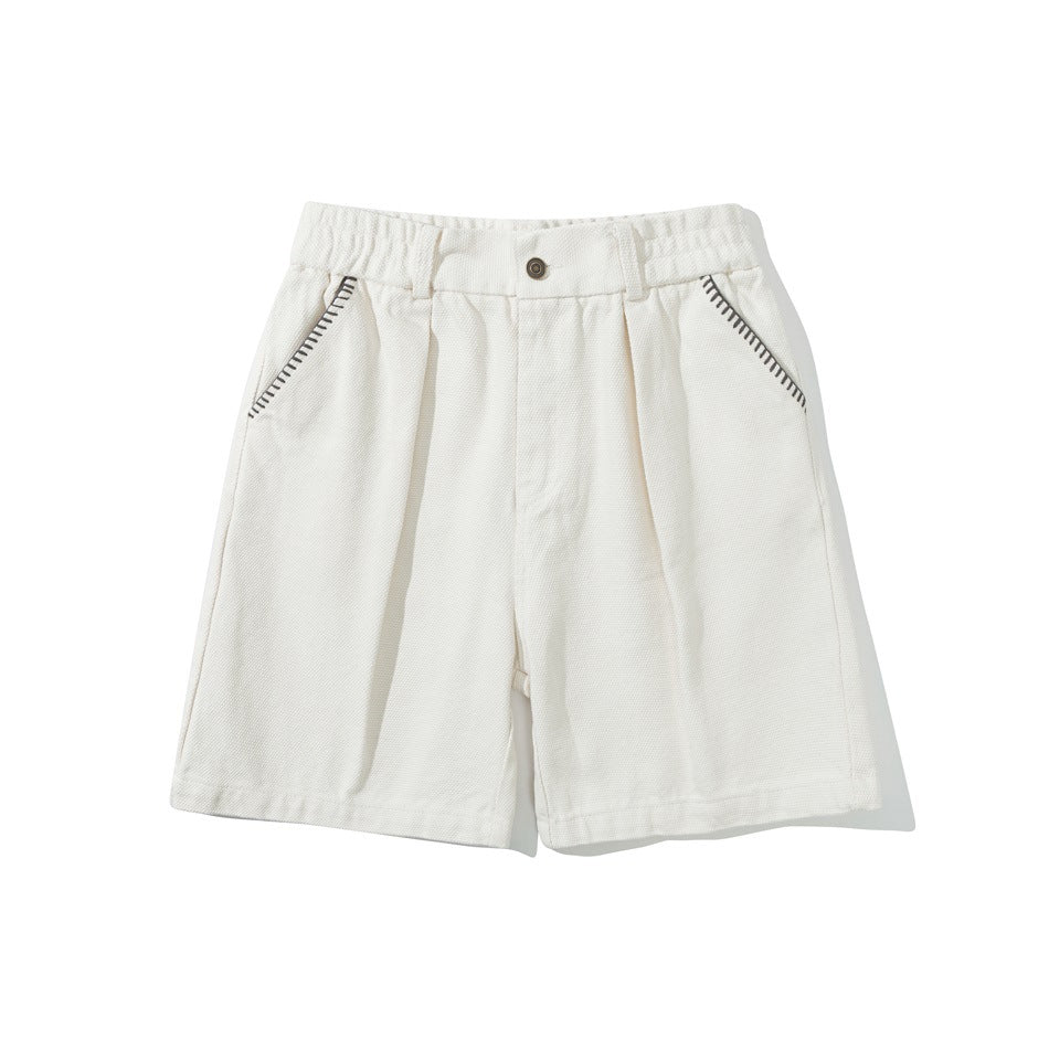 Off-white knee-length shorts with elastic waist, front button, pleats and dark contrast stitching on the pockets