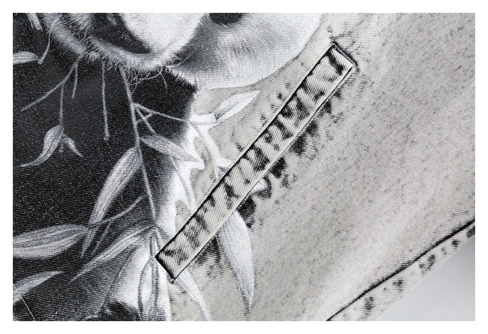 Close-up of a black-and-white printed graphic and a narrow patterned trim strip on the jacket.