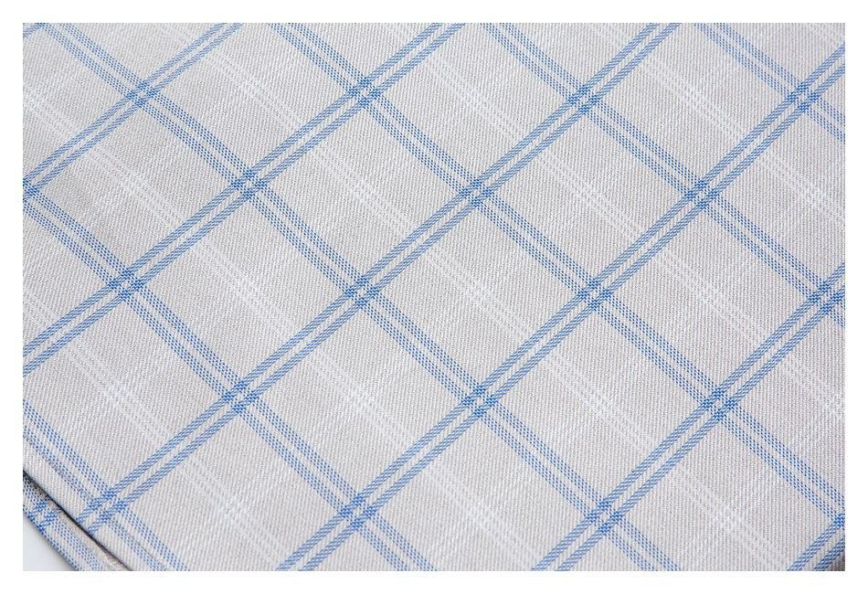 Close-up of the light gray fabric's blue windowpane check pattern.