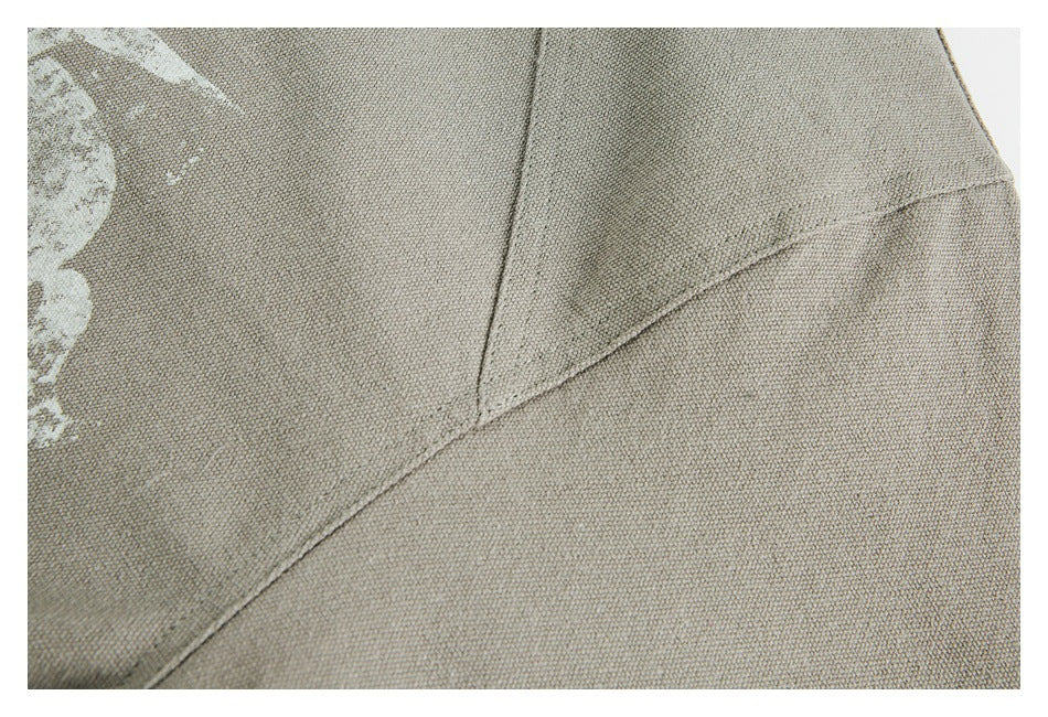 Close-up of the jacket's textured surface and intersecting shoulder seams.