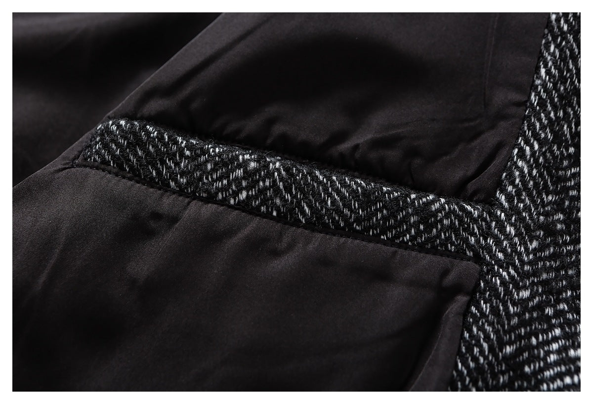 Close-up of black lining joined to black-and-white herringbone fabric along a seam.