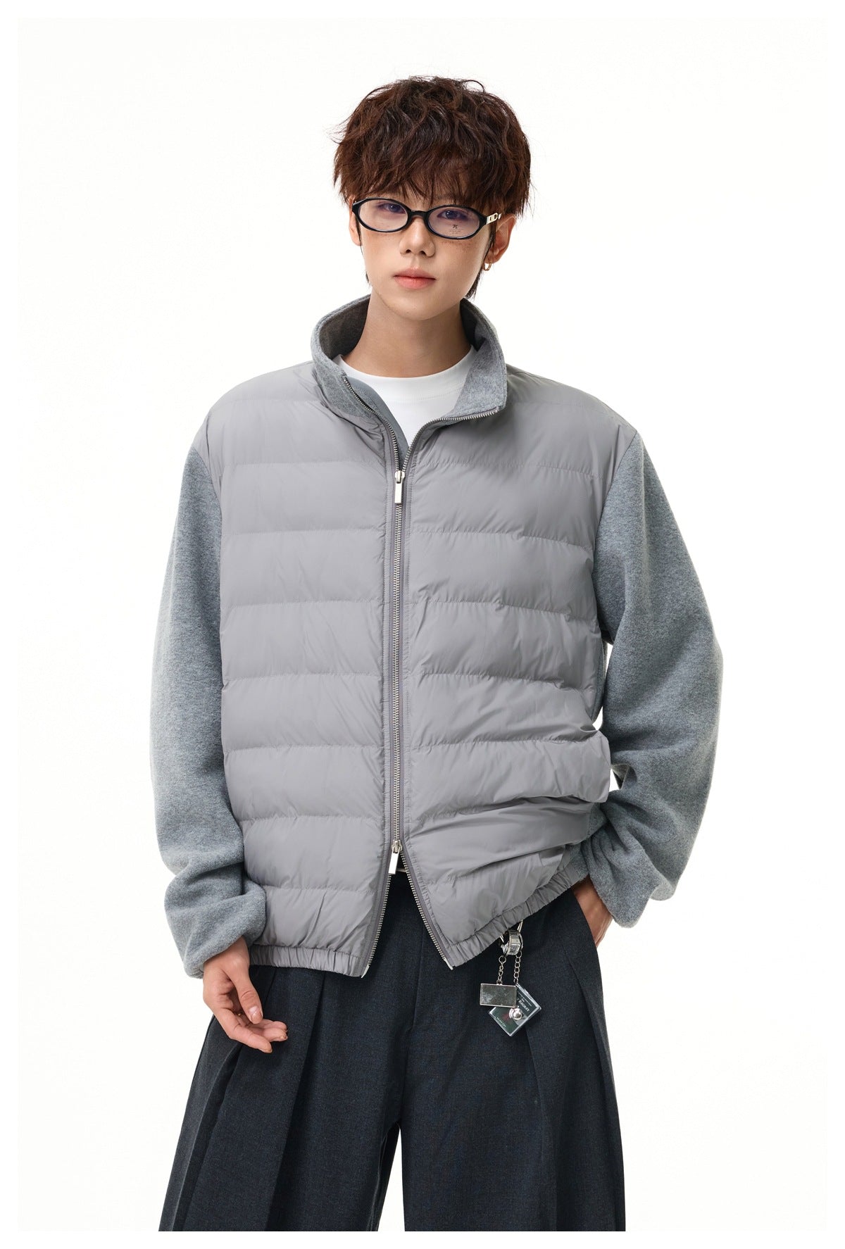 Model wearing a gray zip-front quilted jacket with gray fleece sleeves and collar.