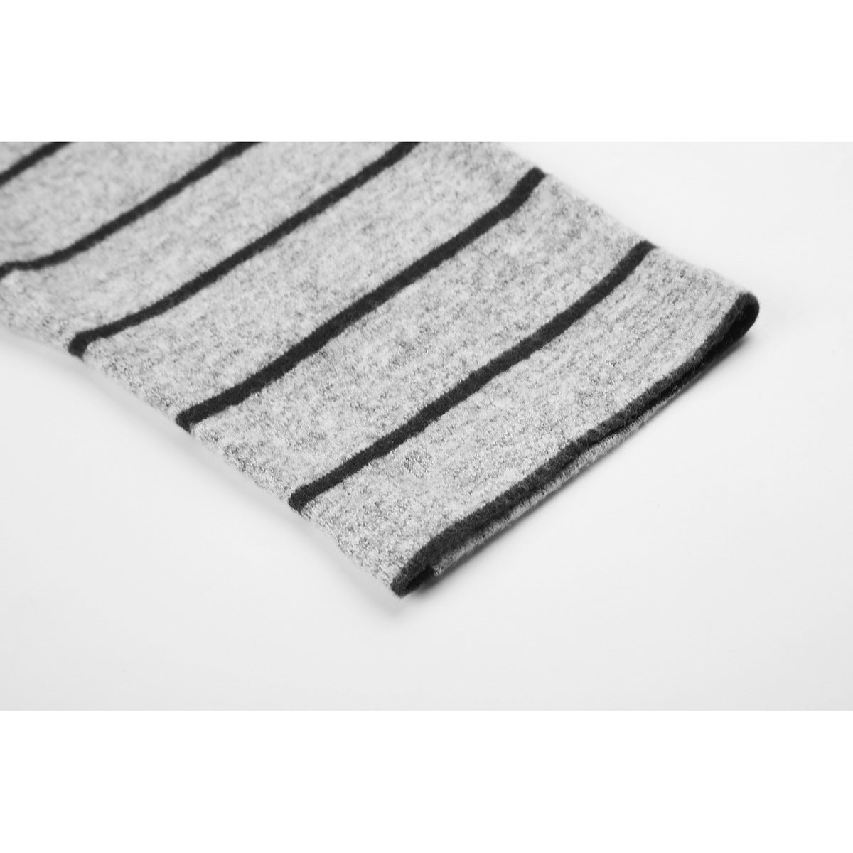 Close-up of the sleeve cuff on a gray marl shirt with black horizontal stripes.