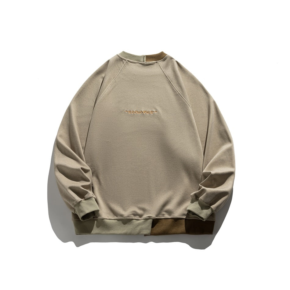 Front flat lay of a taupe crewneck sweatshirt with contrasting olive ribbed trim and a brown hem panel.
