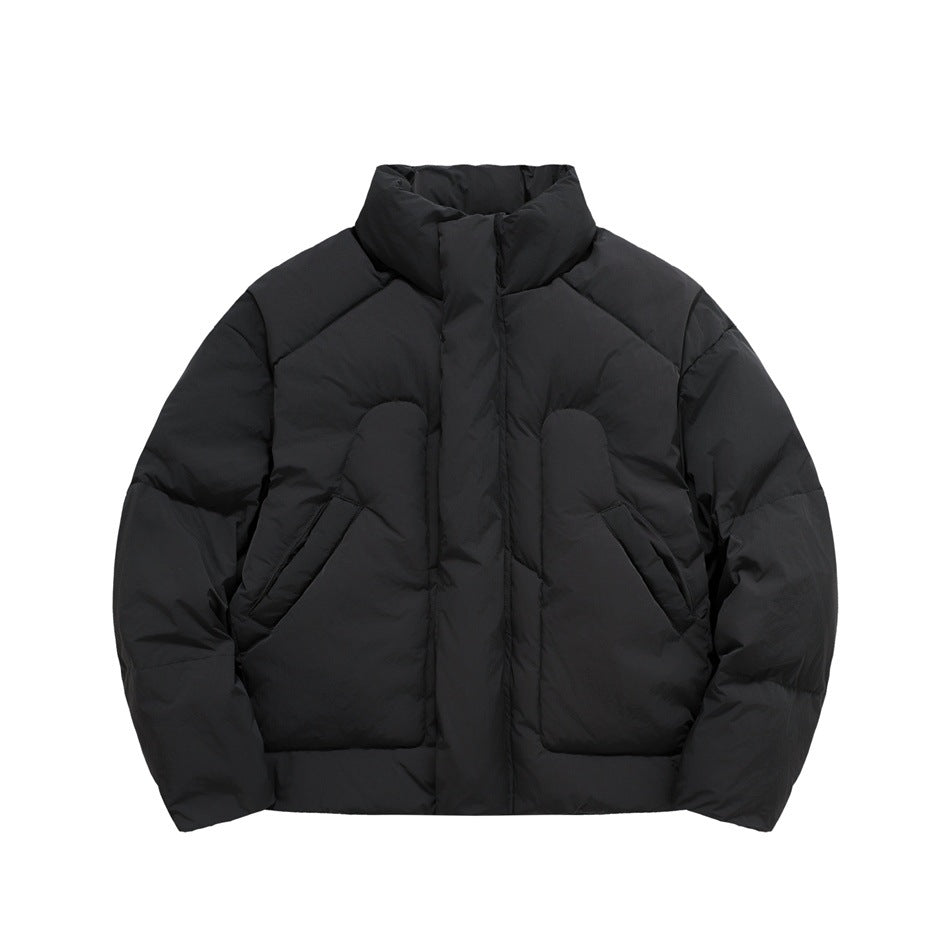 Black puffer jacket front view, zipped, with stand collar, quilted contoured panels and slash pockets