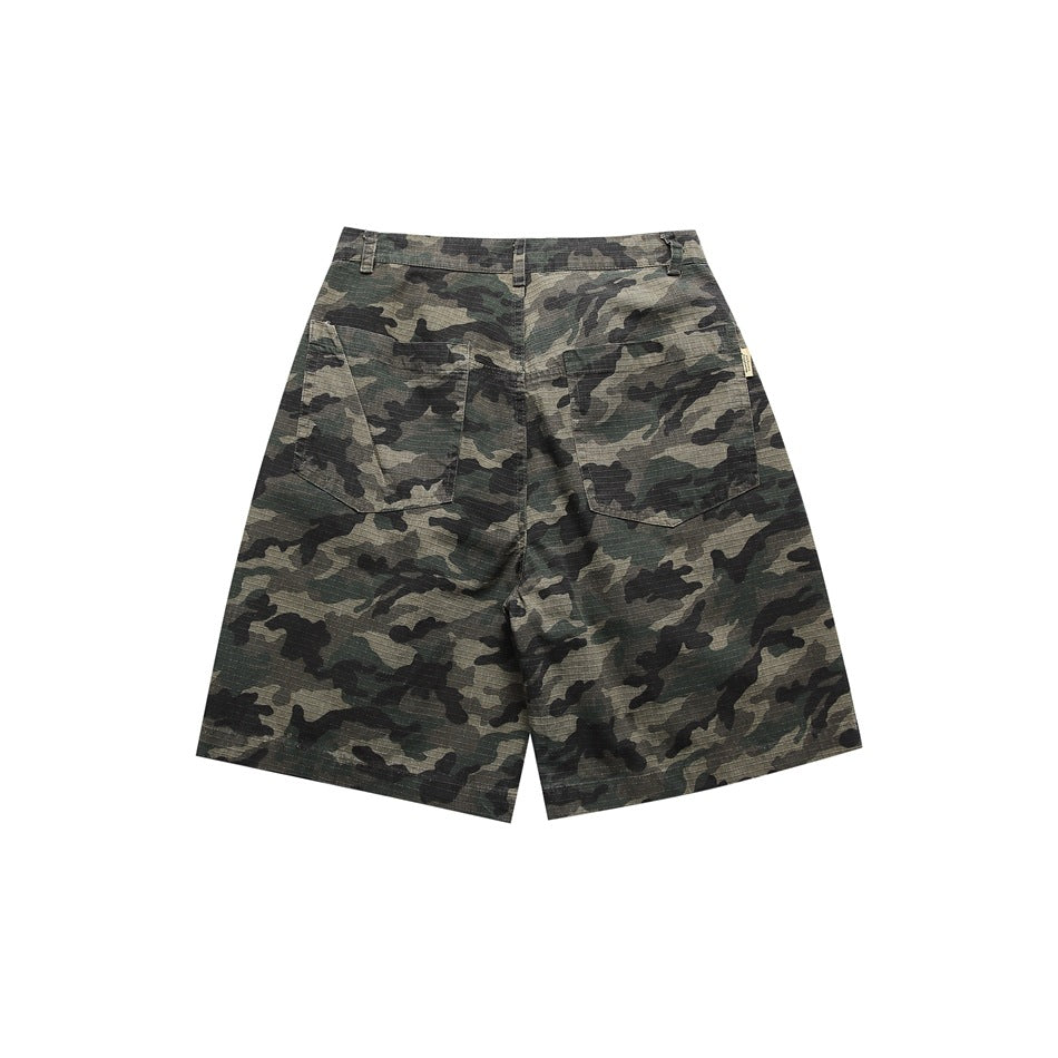 Back of camouflage knee-length shorts showing two patch pockets and belt loops on a white background
