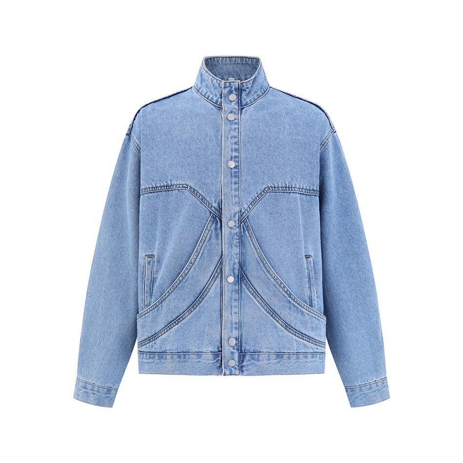 Front view of a light blue denim jacket with a stand collar, silver snaps, long sleeves, and curved front pockets.
