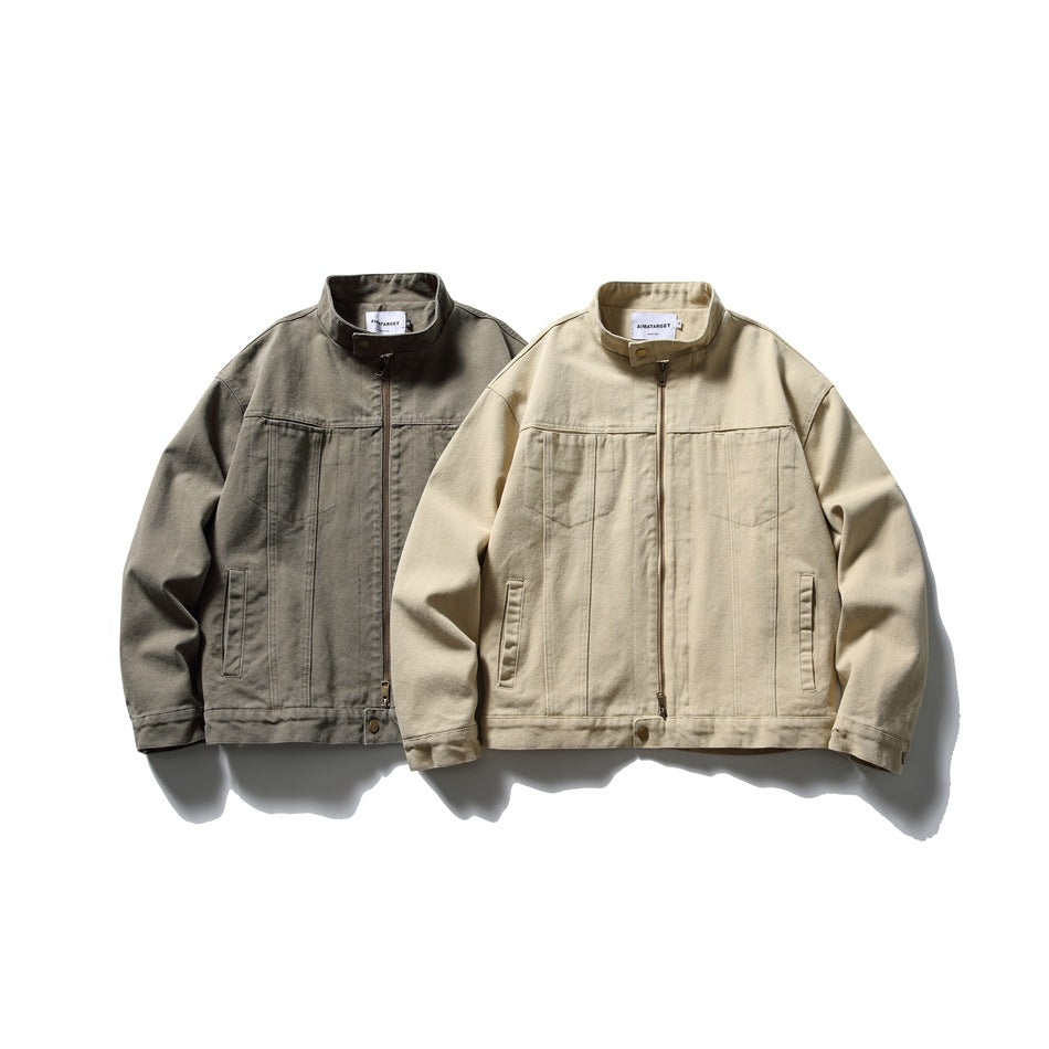 Two jackets shown from the front: one dark gray and one sand-colored, both with stand collars and front zippers.
