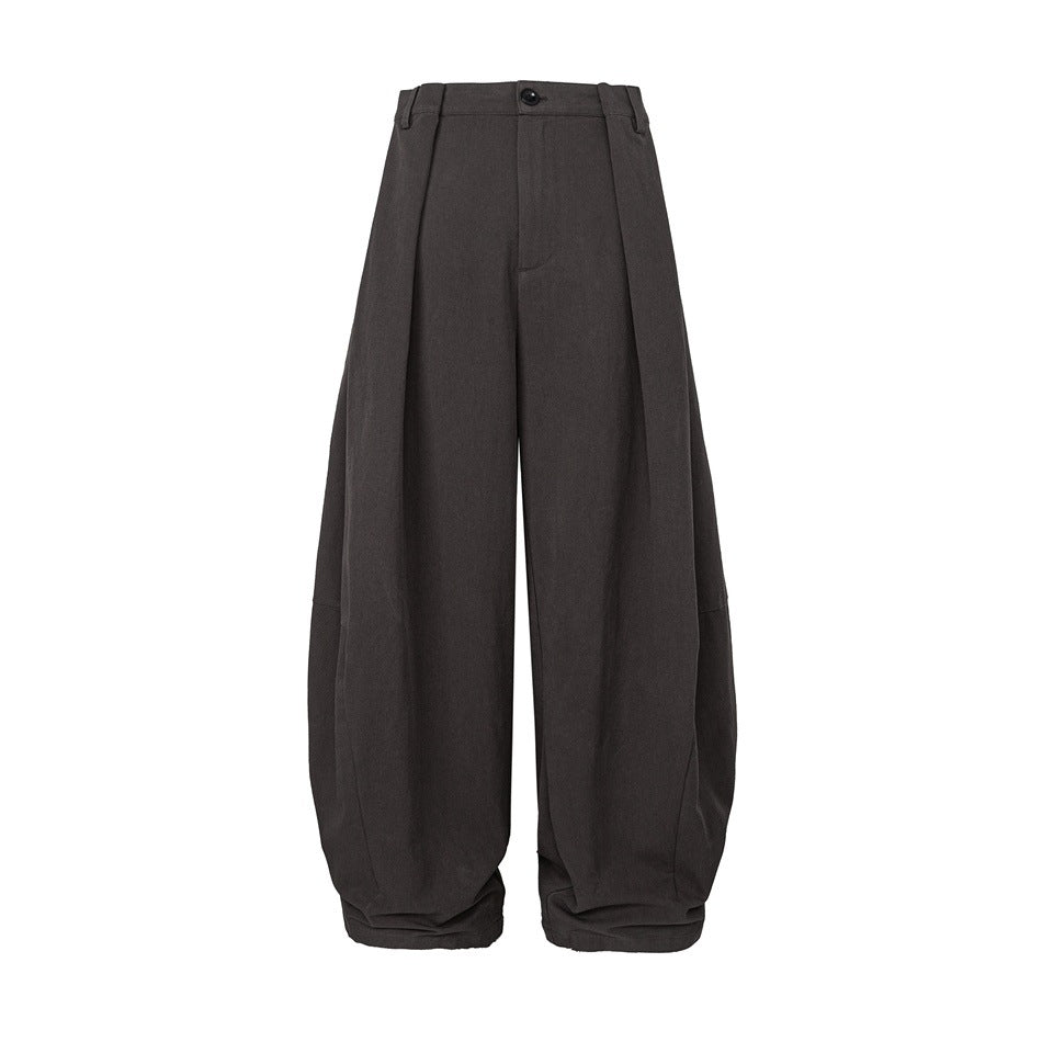Dark brown-gray wide-leg pleated barrel trousers, front view on a white background