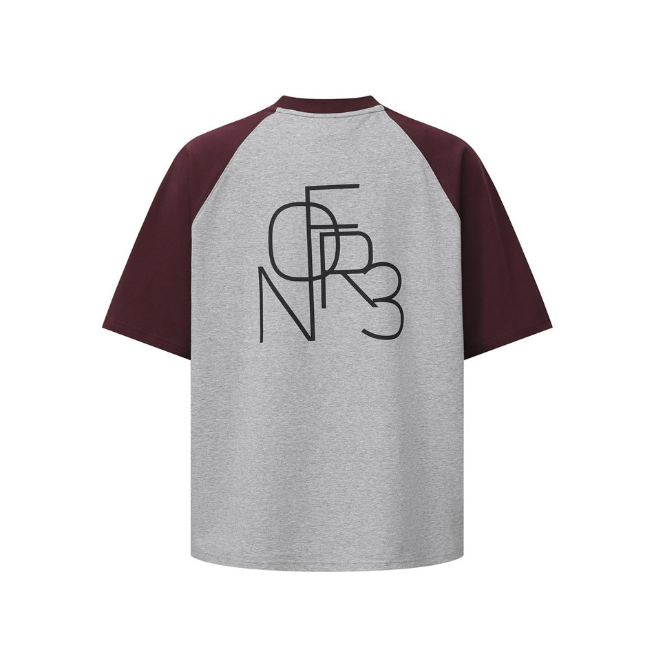 Back of a heather gray raglan T-shirt with burgundy sleeves and collar and a large black line-art letter graphic