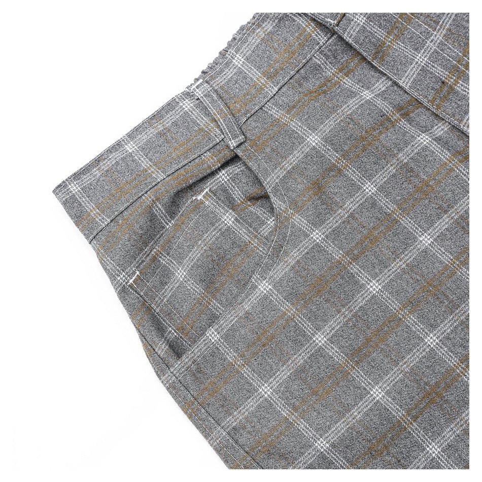 Close-up of the gray plaid trousers' side pocket, waistband, and belt loop.