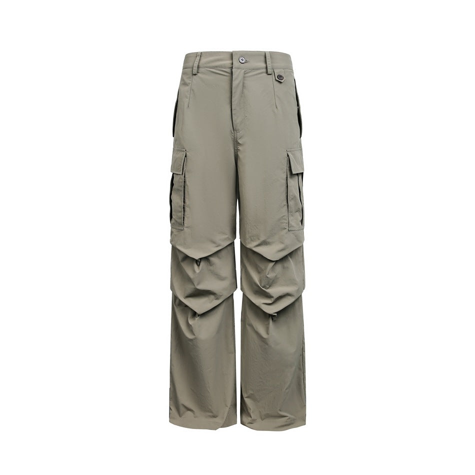 Army green wide-leg cargo pants with flap pockets and knee pleats, flat front view on a white background