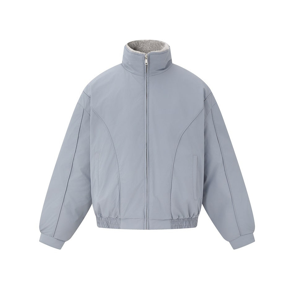 Gray-blue zip-front jacket with stand collar, curved seams, side pockets and elastic hem on white background