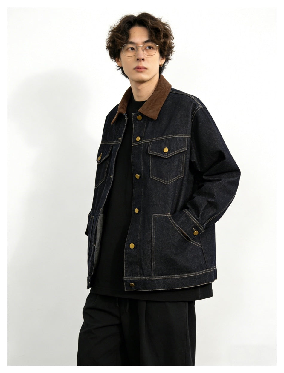 Model wearing a dark denim jacket with a brown collar, contrast stitching, flap pockets, and gold-tone buttons.