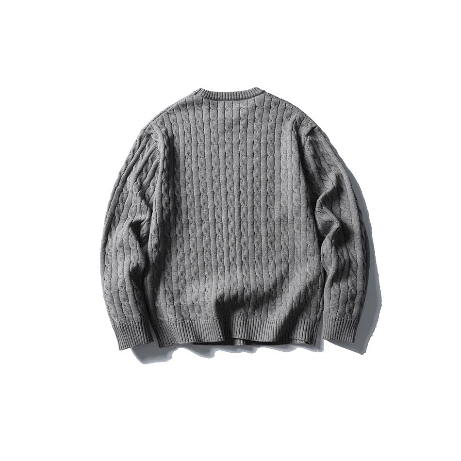 Back view of a gray cable-knit crewneck sweater with long sleeves and ribbed trim.
