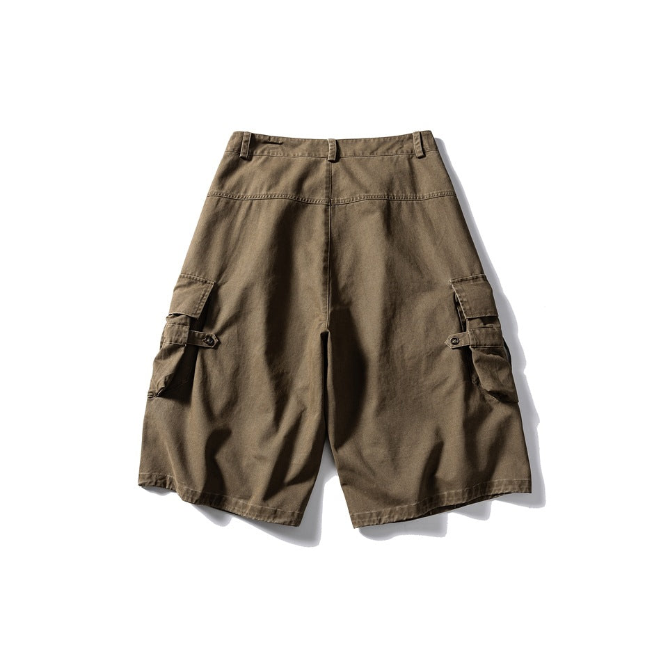Back view of khaki-brown cargo shorts with a center seam, belt loops and side flap pockets.