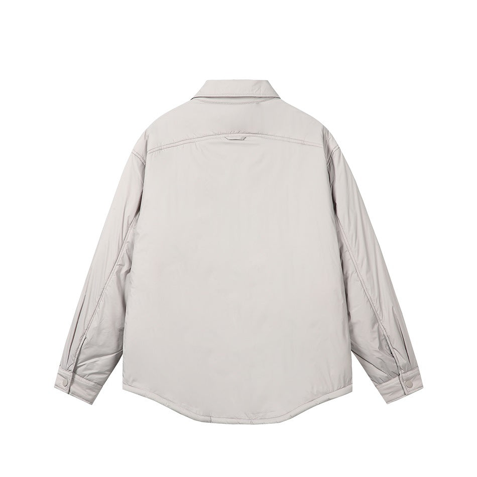 Back view of a light gray shirt-style jacket with a curved hem, long sleeves, and snap cuffs.