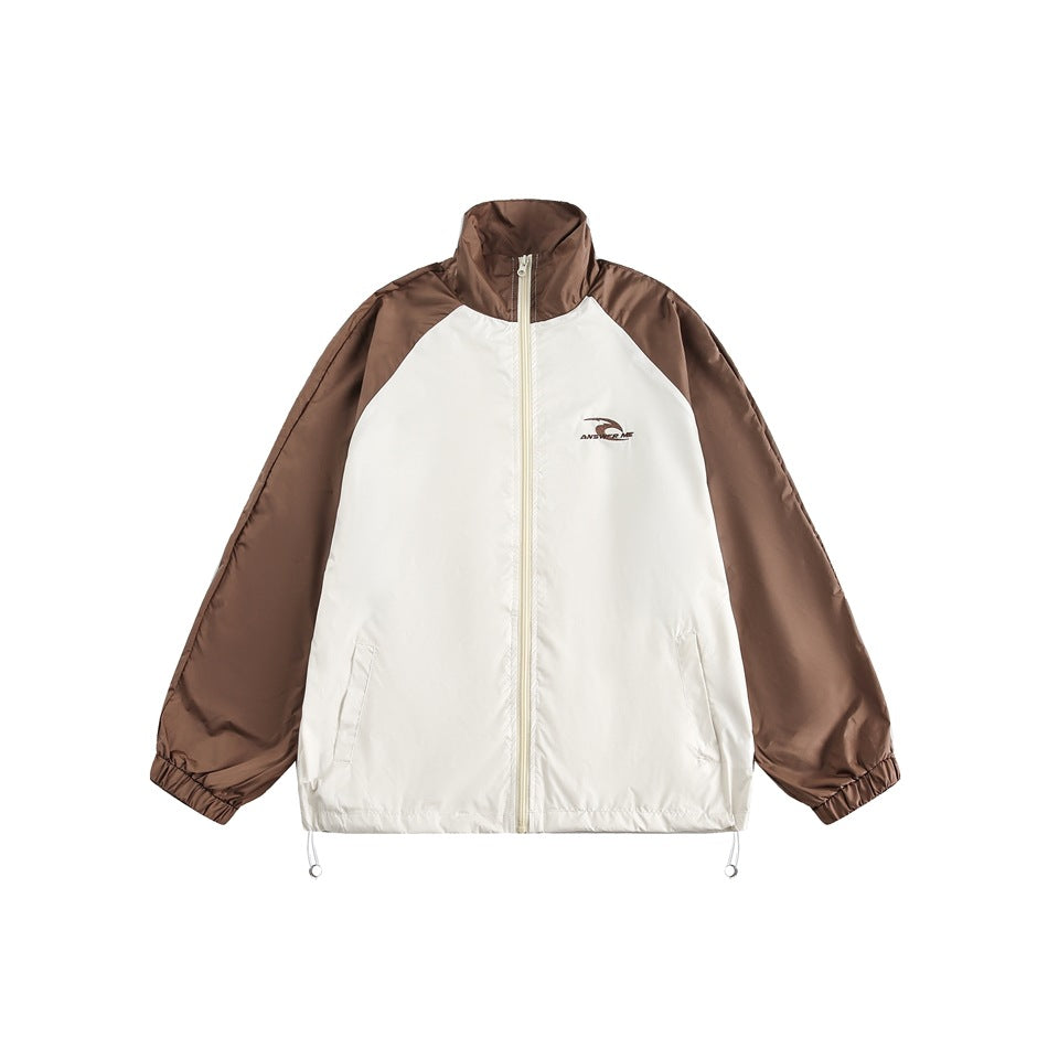 Brown and cream color-block zip jacket with stand collar, raglan sleeves, elastic cuffs and drawcord hem, flat front view