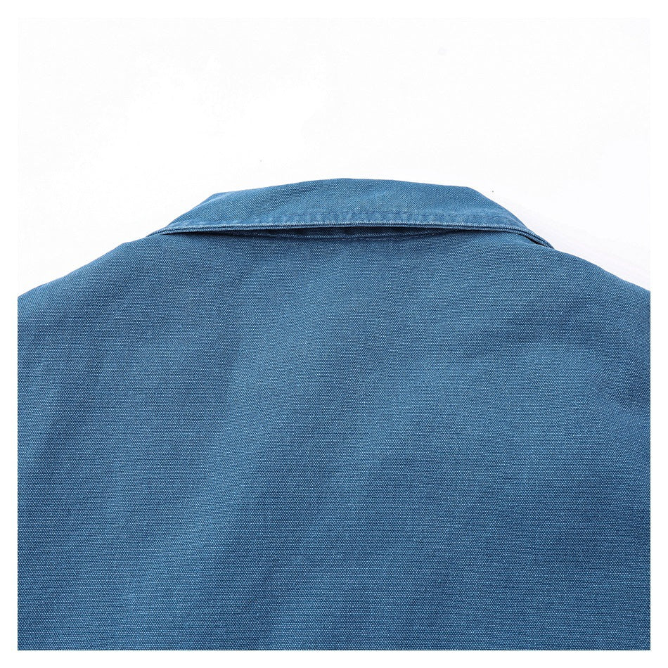 Close view of the blue garment's back neckline and collar against a white background.