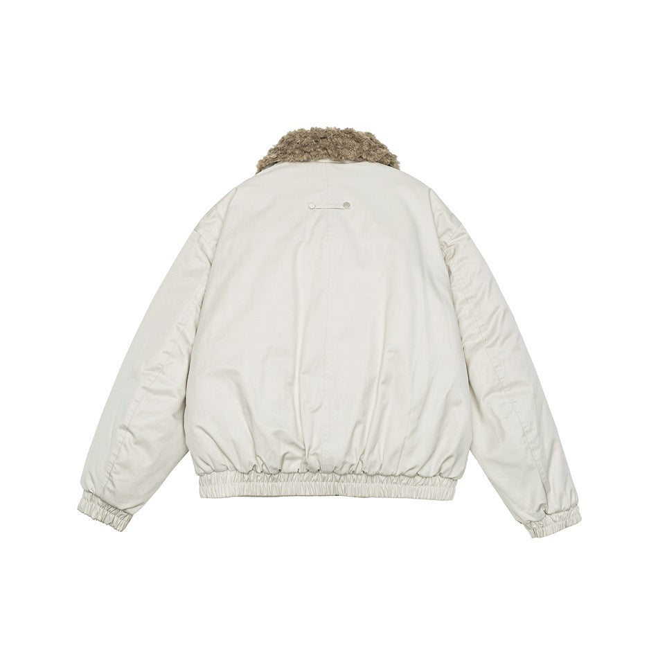 Back view of off-white jacket with tan fleece-like collar, elastic hem and cuffs, and a small snap-bar detail