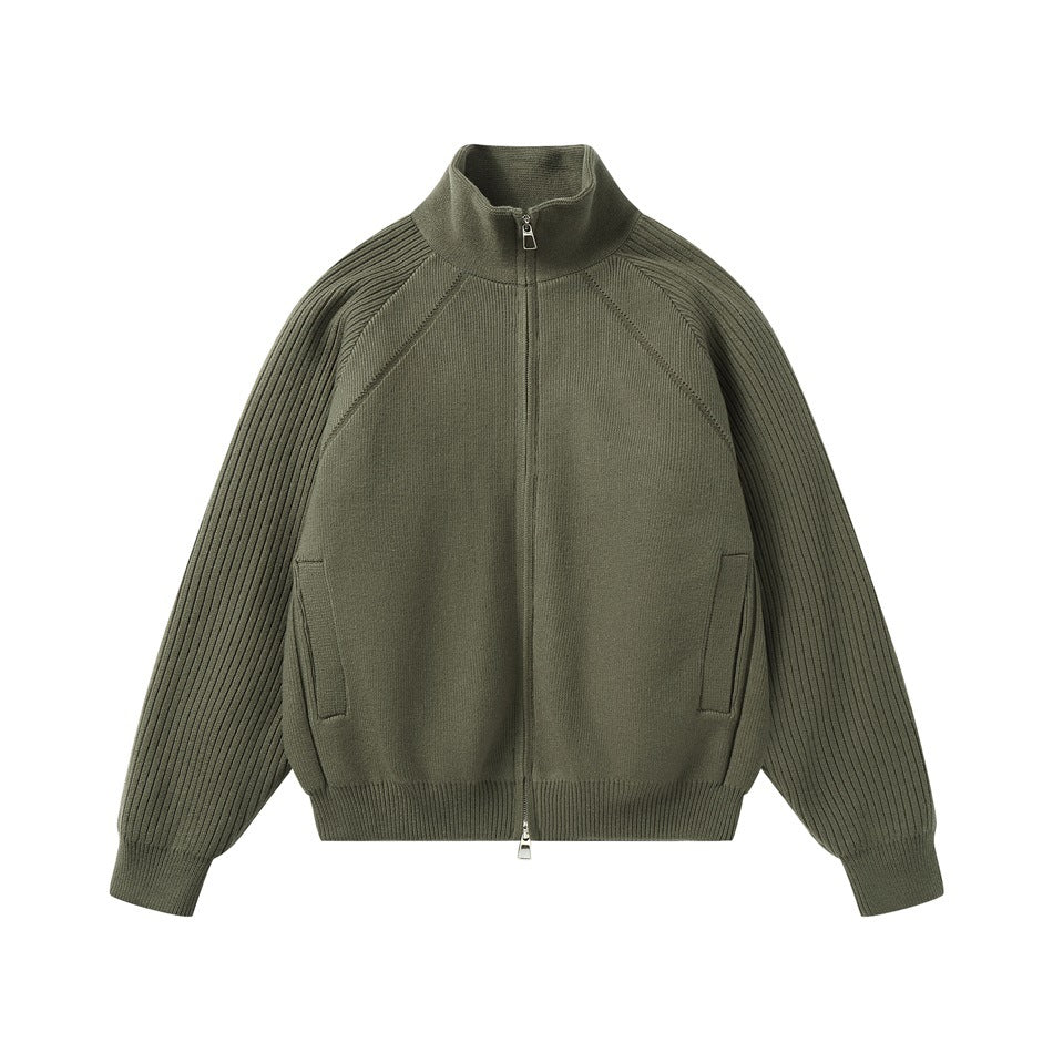 Olive green zip-front knit jacket with a stand collar, ribbed raglan sleeves, and two front pockets.