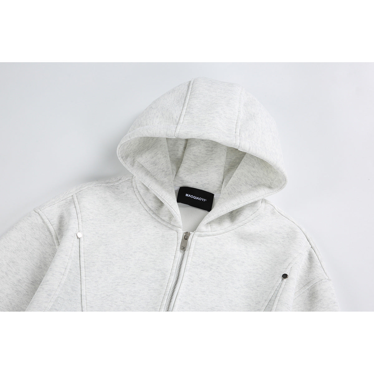Close-up of a light gray heather zip-up hoodie, showing the hood, neckline, zipper, and shoulder seams.