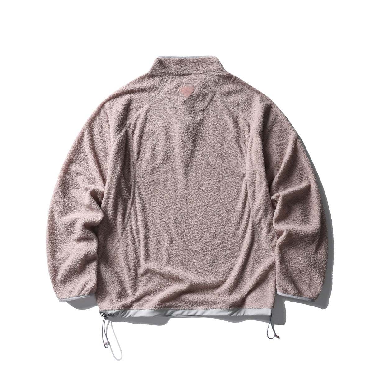 Back view of a dusty pink textured jacket with a high collar, pale hem trim, and adjustable hem cords.