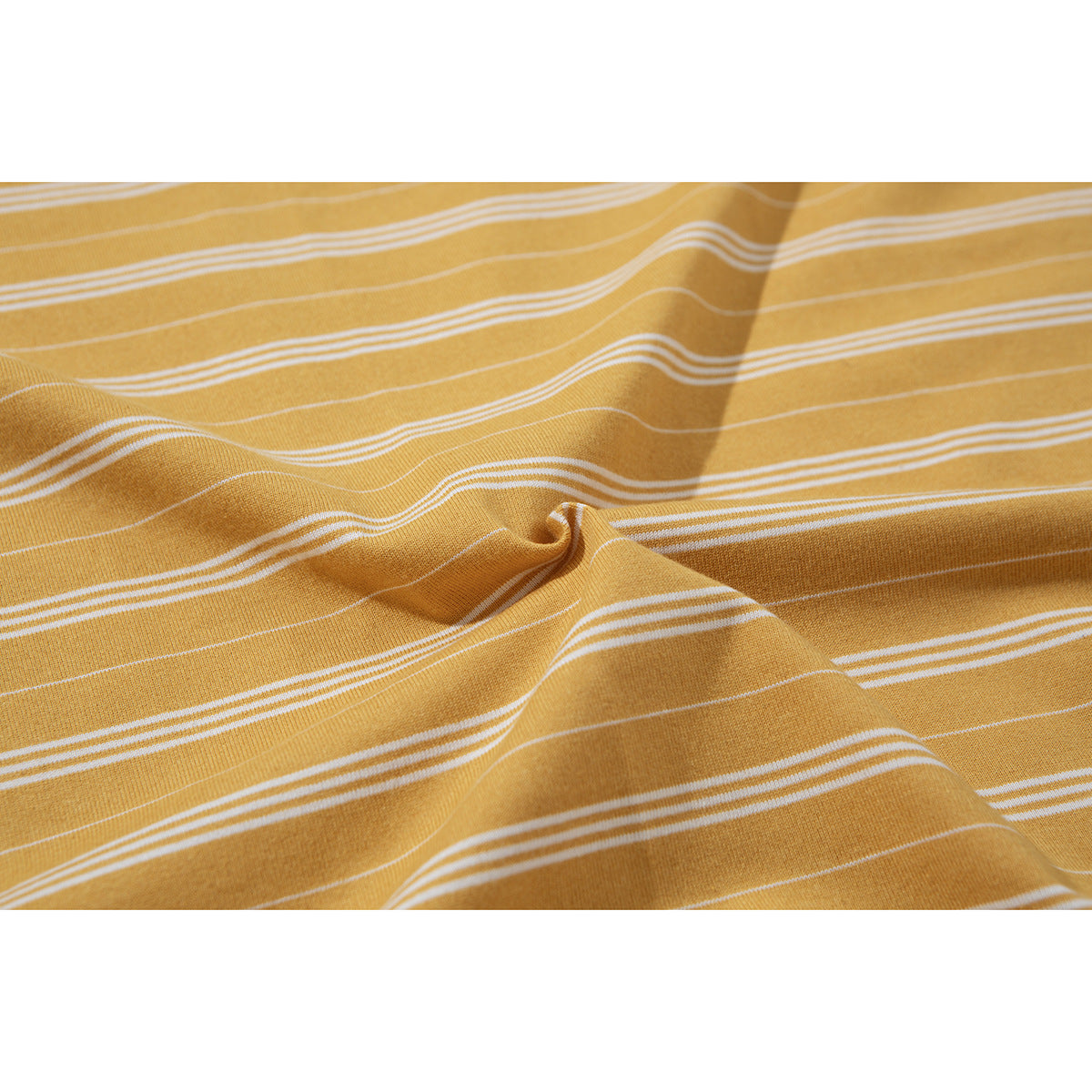 Close-up of mustard yellow fabric with thin white horizontal stripes, draped to show its texture.