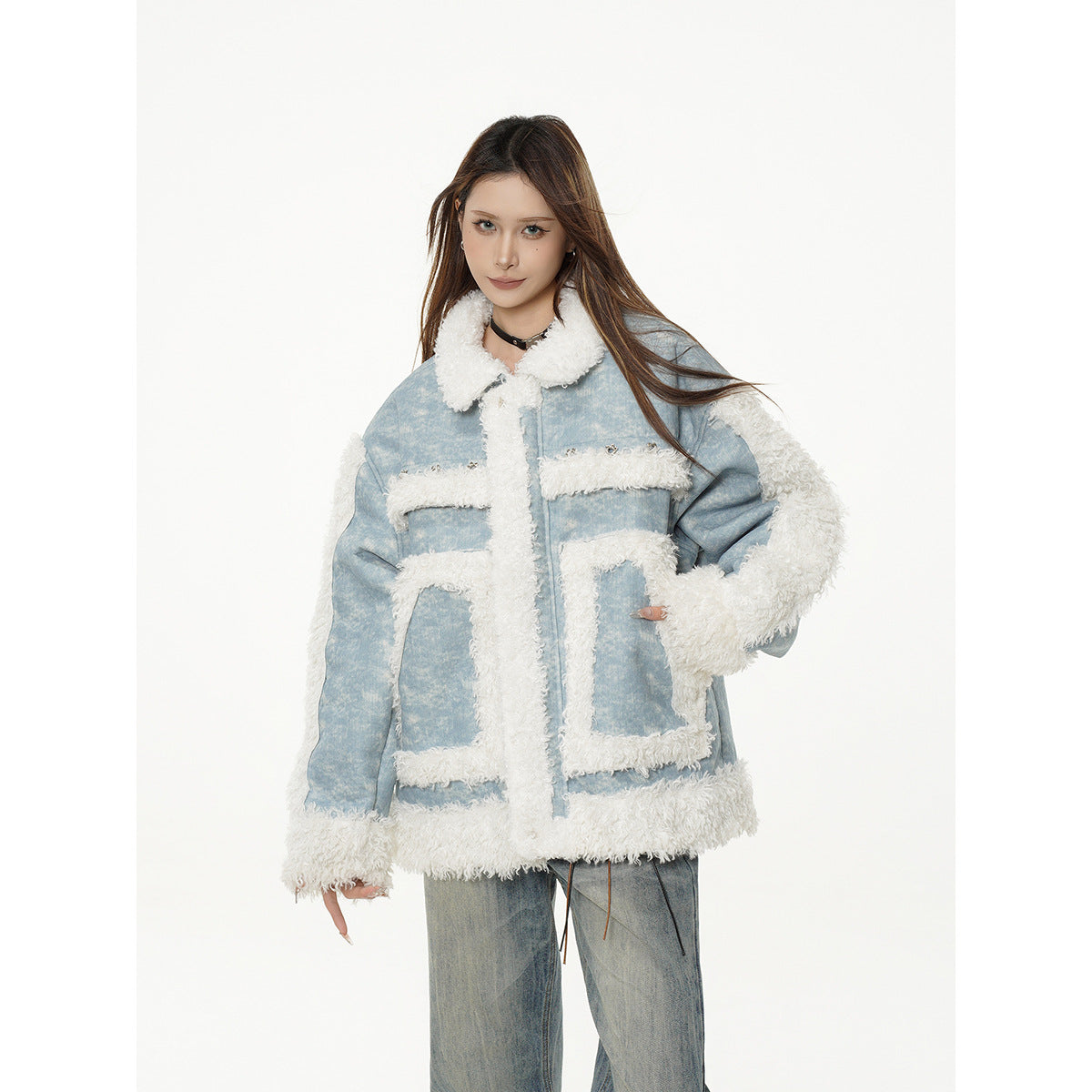 Model wearing a light blue jacket with white shaggy trim, large patch pockets, and matching loose jeans, angled front view.