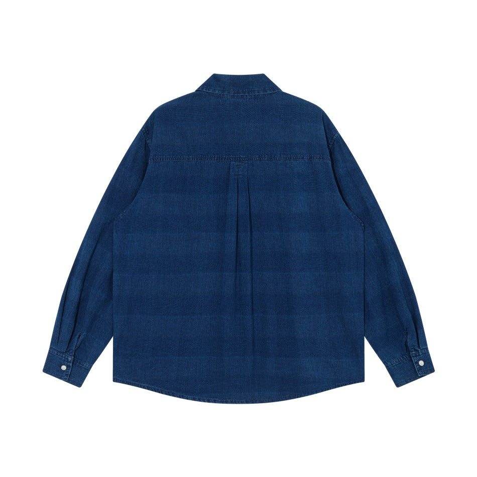 Back flat lay of a blue washed denim-look long-sleeve shirt showing back yoke, center pleat and buttoned cuffs