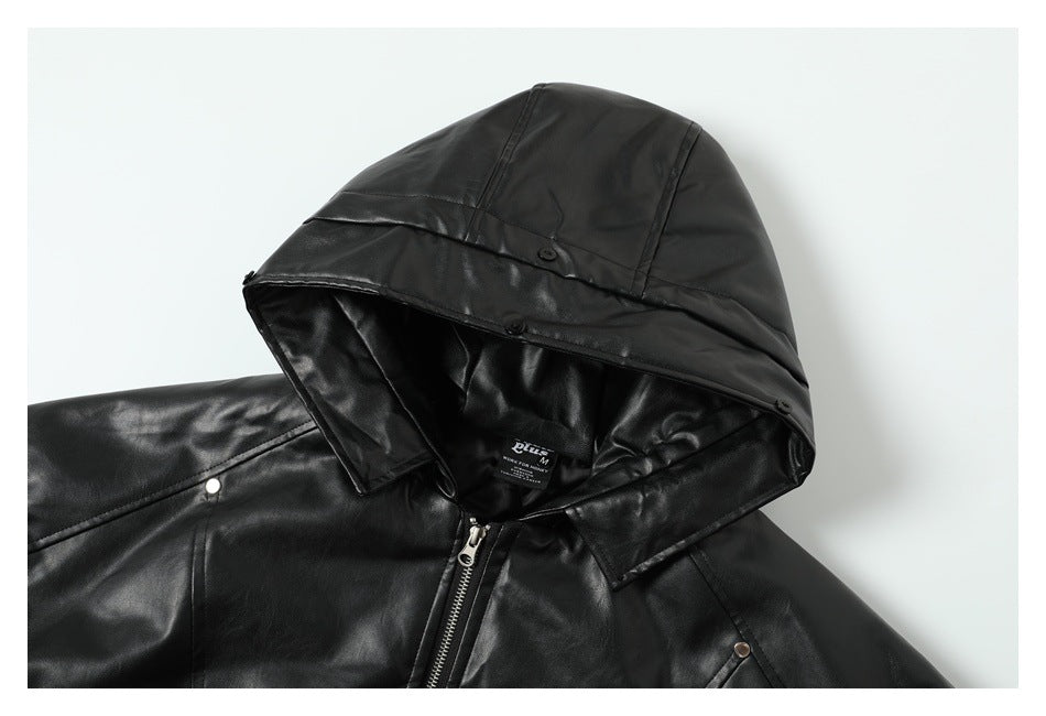 Close-up of a black jacket's hood, snap details, zipper, and inner neck label.