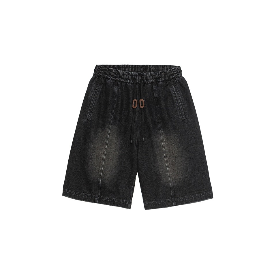 Black washed denim shorts with elastic drawstring waist and brown toggles, front flat lay