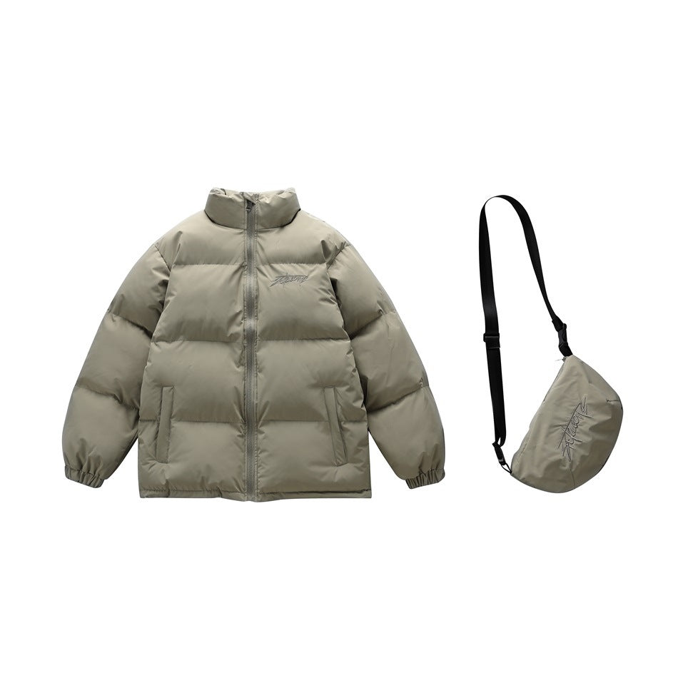 Front view of a gray-green puffer jacket beside its matching crossbody bag with an adjustable black strap.