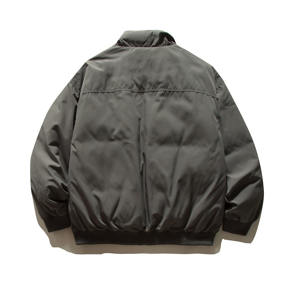 Back view of a dark gray jacket with a stand collar, gathered sleeves, and ribbed cuffs and hem.