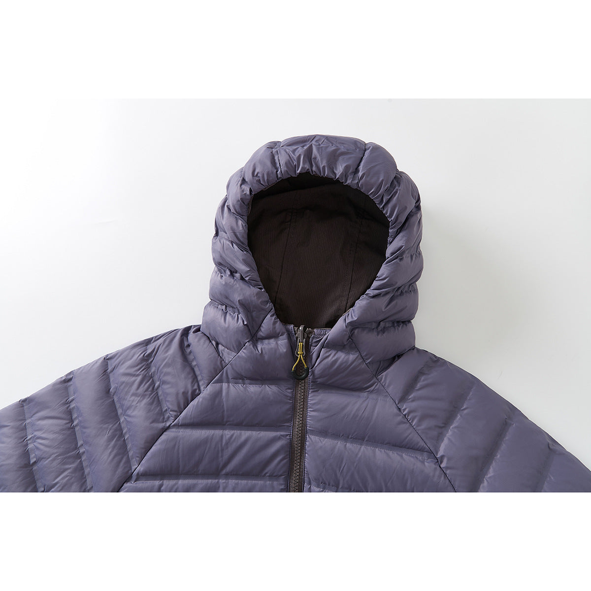 Close-up of a lavender-gray quilted jacket's hood, black lining, and front zipper.