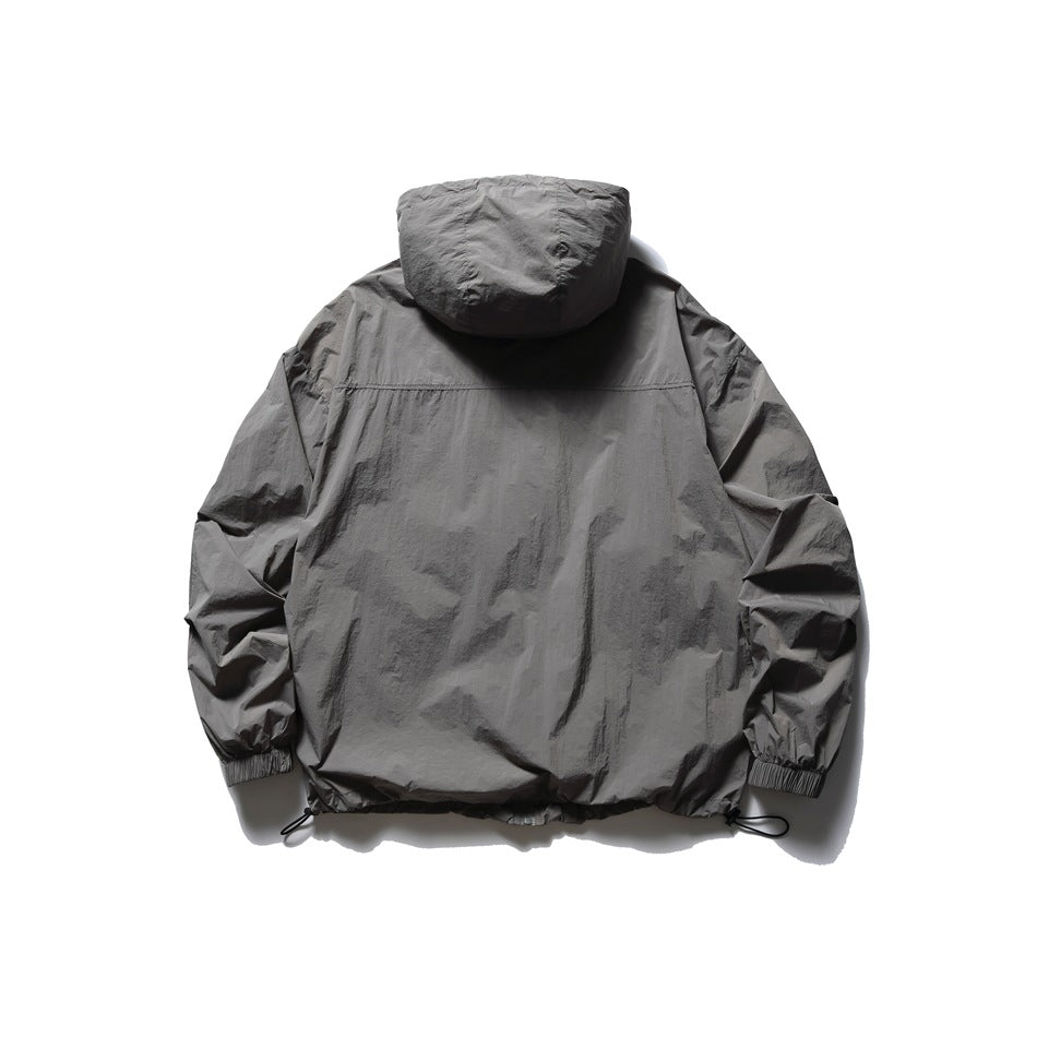 Back view of a charcoal gray hooded jacket with elastic cuffs and adjustable drawcord hem.