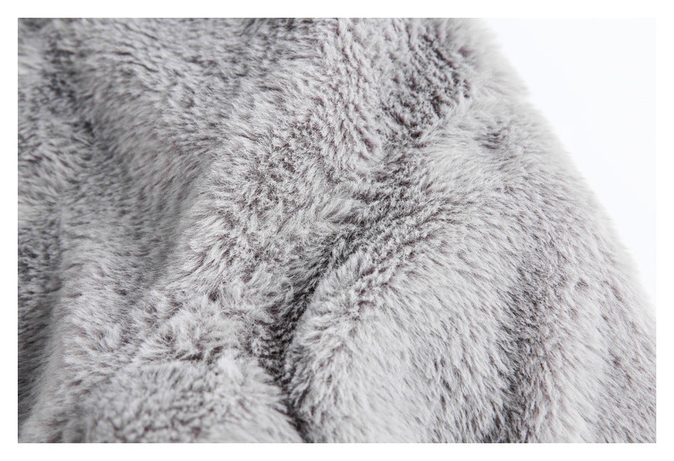 Close-up showing the dense gray and white shaggy texture of the garment.