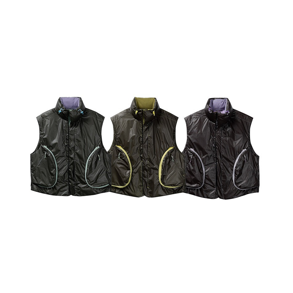 Three glossy sleeveless vests shown together in dark gray, olive charcoal and black, each with contrasting pocket trim.