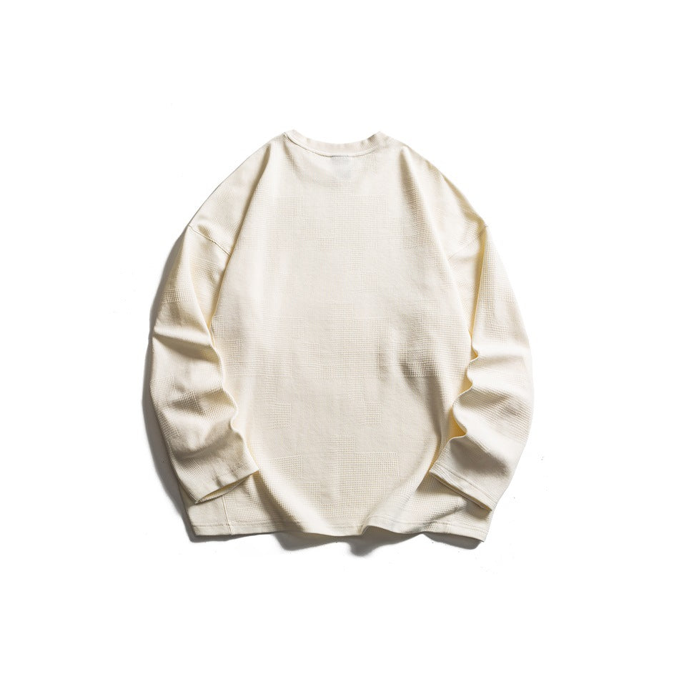 Back view of cream long-sleeve crew-neck sweatshirt flat lay showing textured block pattern