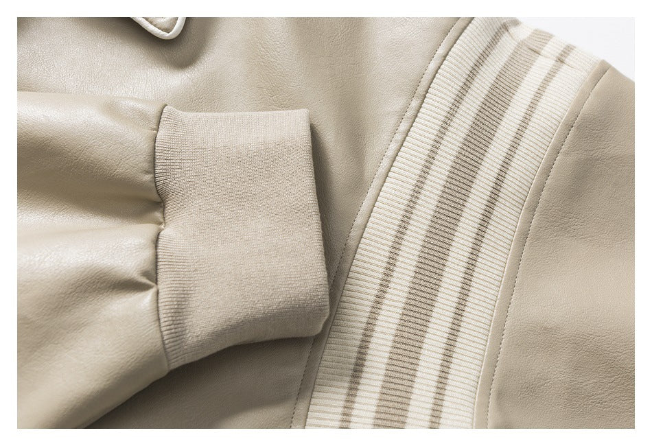 Close-up of a beige jacket sleeve cuff and striped ribbed trim.