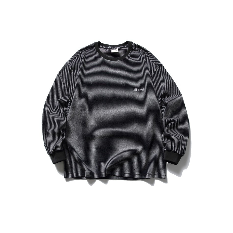 Black striped long-sleeve crew-neck top with white fine stripes and ribbed cuffs, flat lay front view