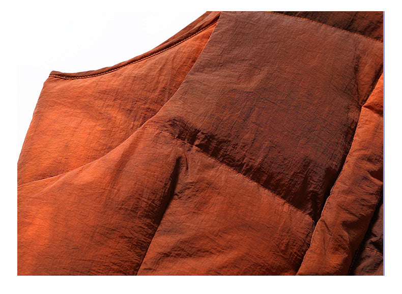 Close-up of rust-orange padded fabric panels and their stitched seam.