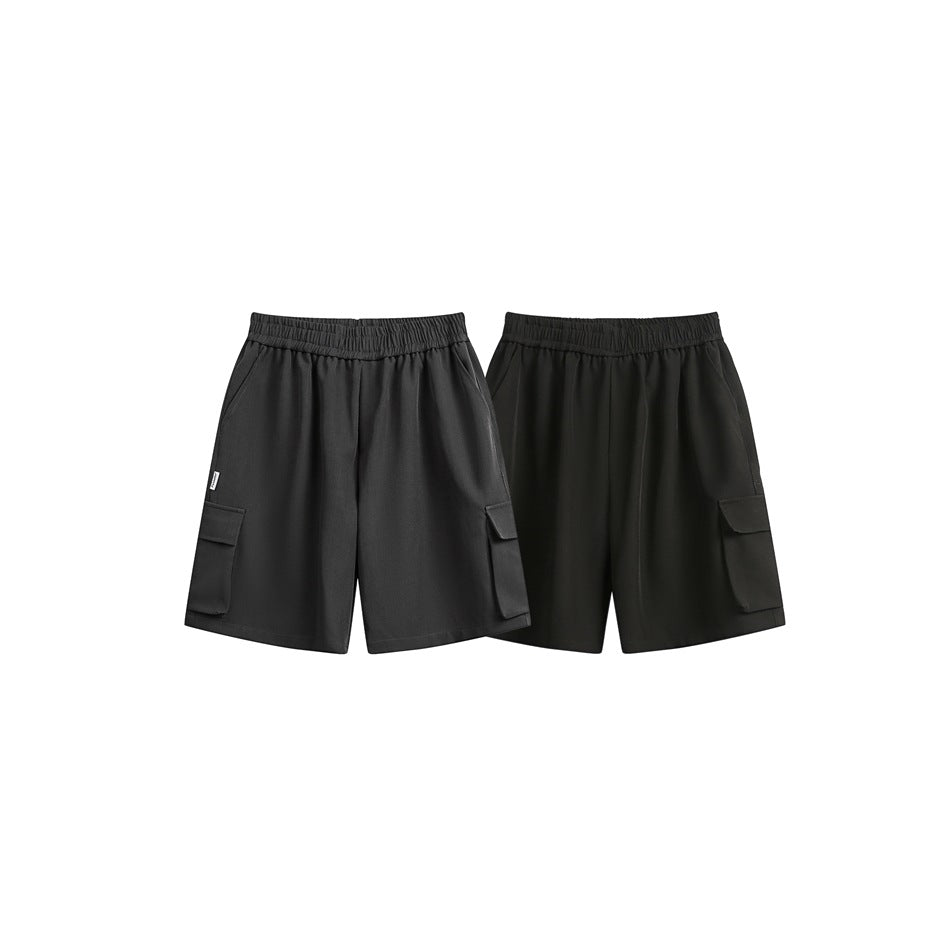 Two pairs of loose cargo shorts shown from the front in charcoal gray and black.
