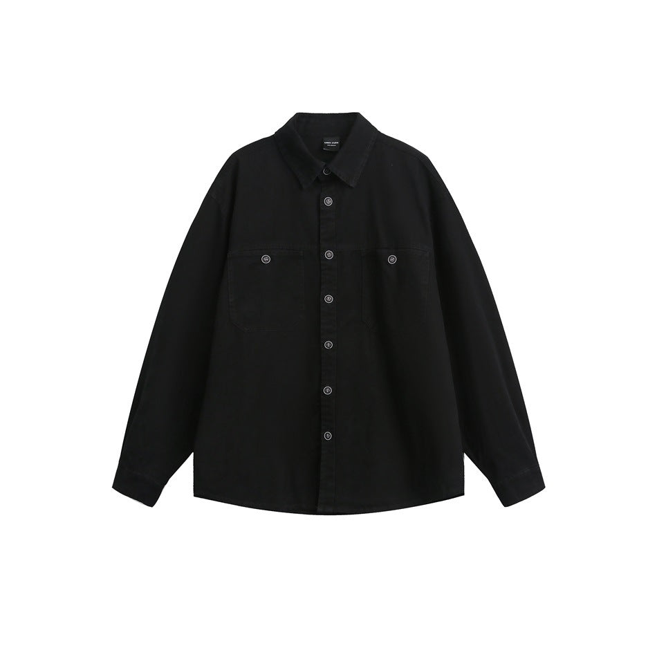 Black long-sleeve button-front shirt with two chest flap pockets and a pointed collar, flat lay on white