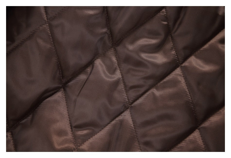 Close-up of the coat's brown diamond-quilted lining.