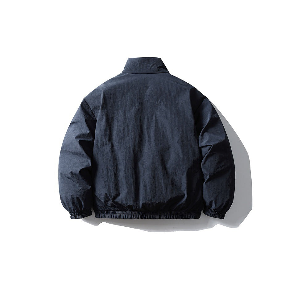 Back view of navy blue padded jacket with stand collar, elastic cuffs and elastic hem band